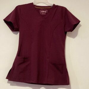 Burgundy Scrub top in excellent pre~loved condition. Front pockets and s…